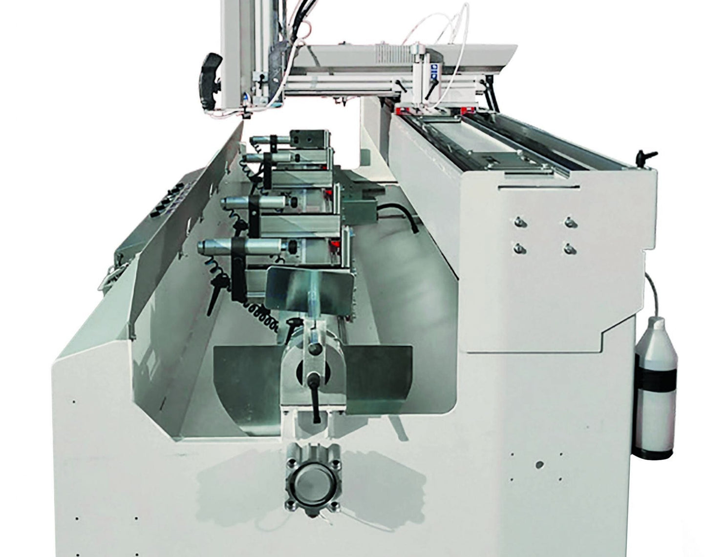 Interior view of the Flex-L copy router displaying horizontal pneumatic clamps and robust cutting components for aluminum and PVC machining.