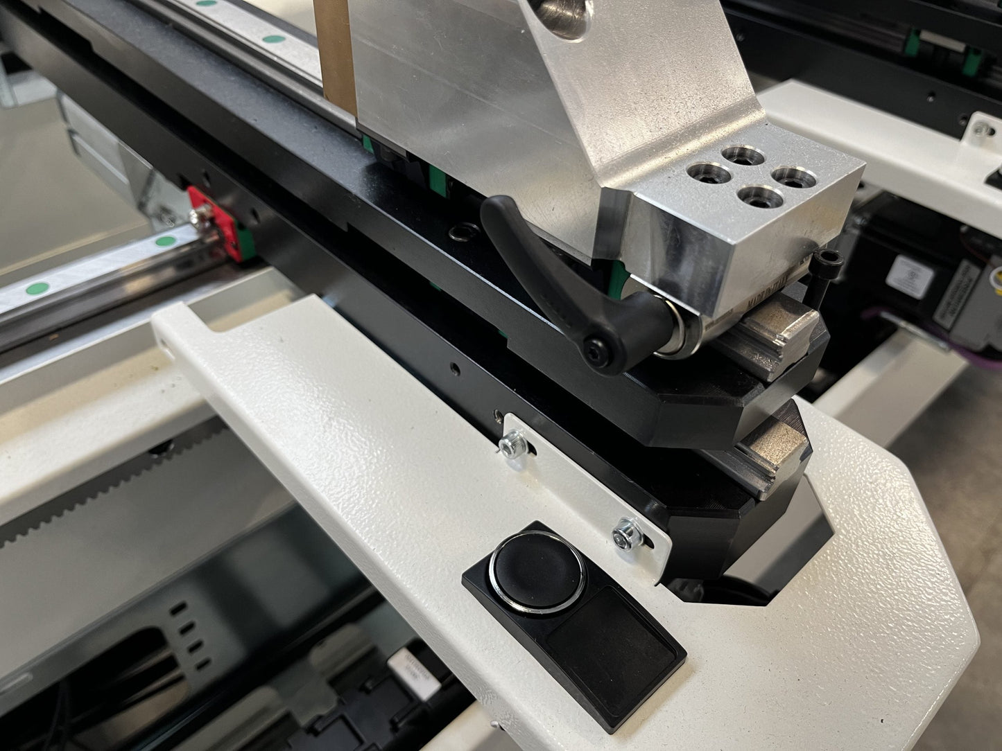 Detailed view of the Bolero 5 CNC machining center's linear guide and clamping mechanism, highlighting its precision and stability for machining operations.
