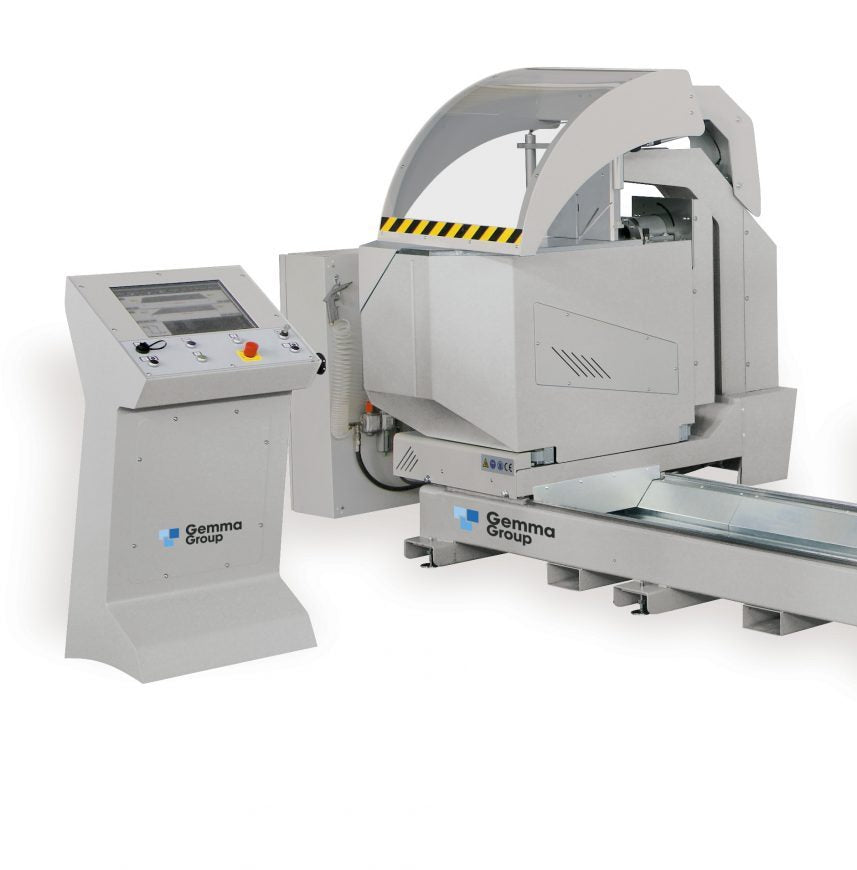 The Selecta P double-head cutting machine during operation, showcasing its robust performance in cutting compound angles on aluminum extrusions.