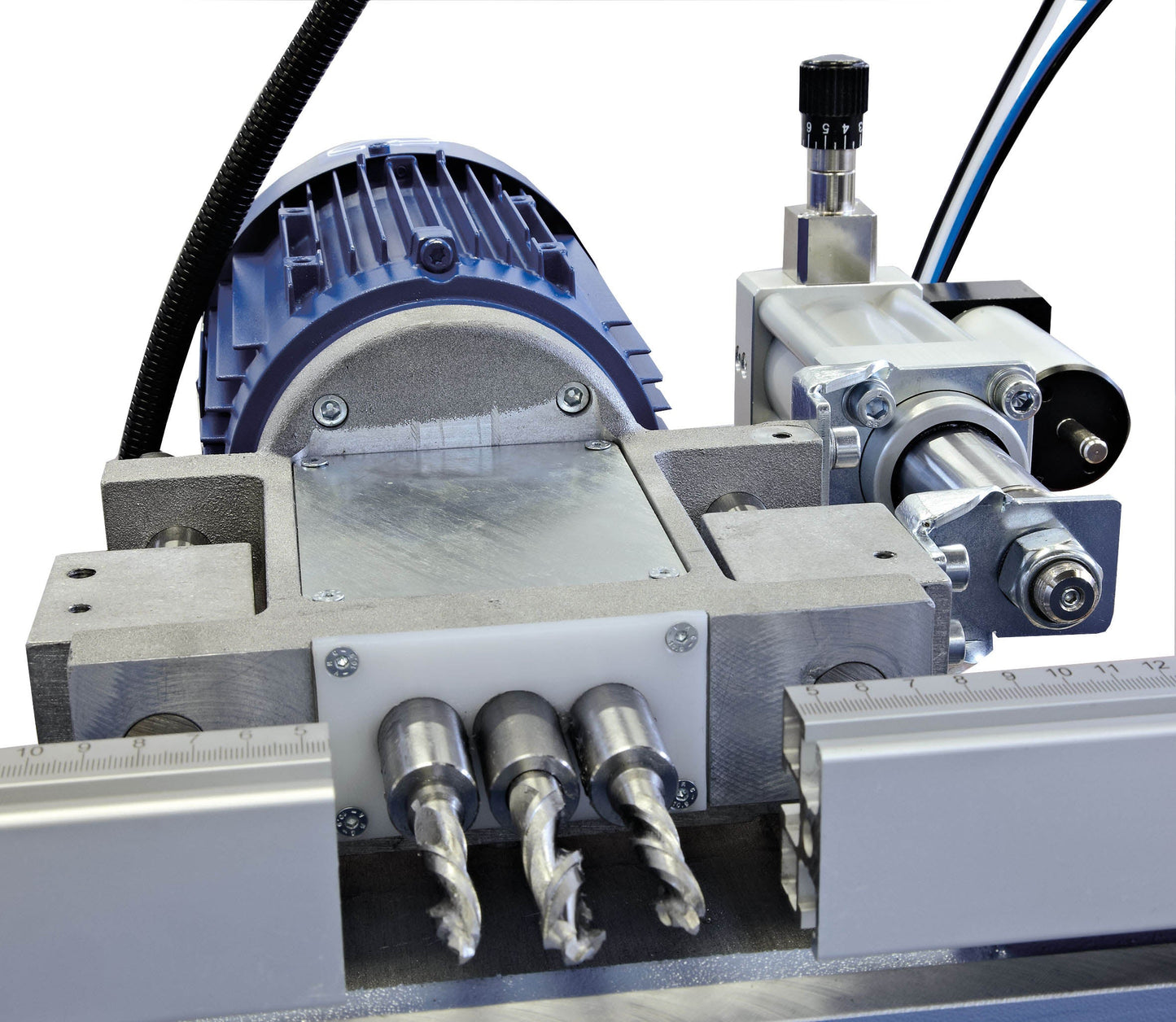 Close-up of the Triplex manual copy router’s drilling bits, demonstrating precision tools for machining various channels on aluminium profiles.