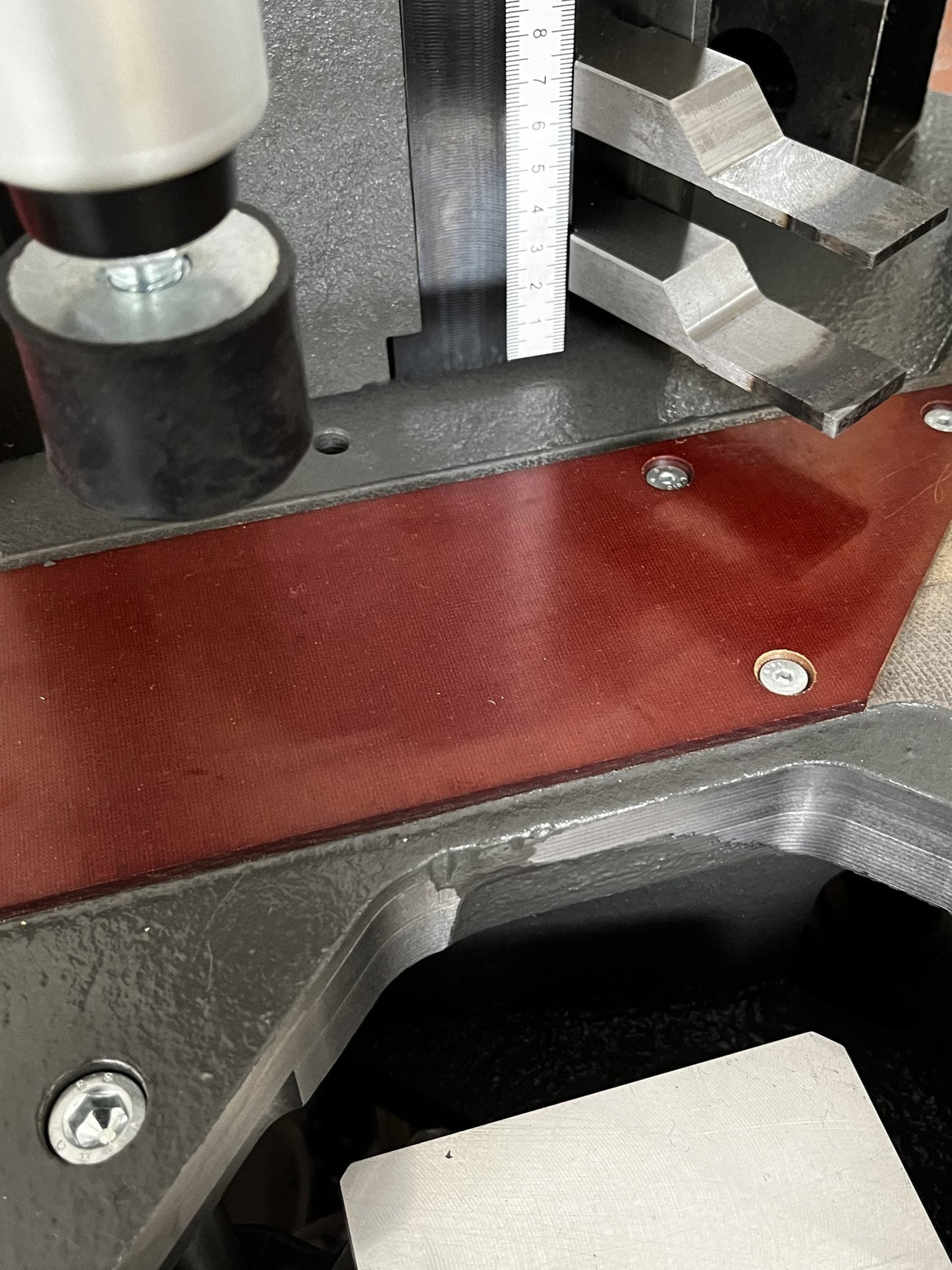 A detailed shot of the crimping tools and working area, illustrating the robust design and precise movement of the Vectra crimping machine.