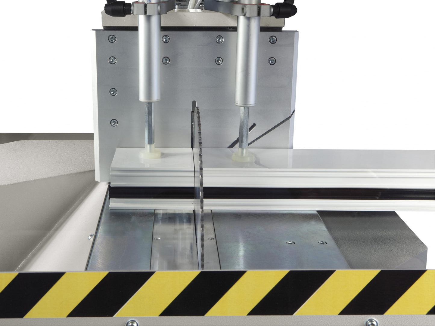 Image of the Kappa single-head cutting-off machine performing a precise 90-degree cut on aluminum profiles.