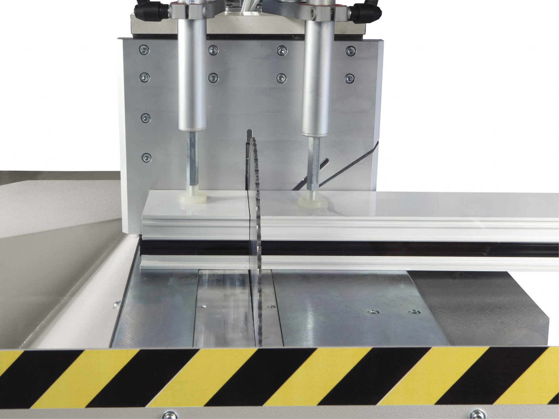 Image of the Kappa single-head cutting-off machine performing a precise 90-degree cut on aluminum profiles.