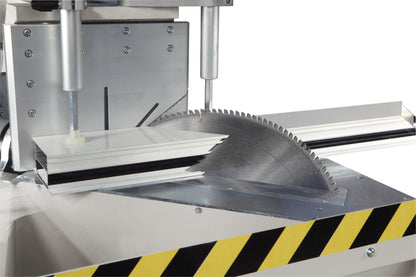 The Kappa single-head cutting-off machine performing a precise 45-degree compound cut on material profiles.