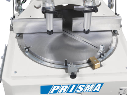 Cutting area of PRISMA machine showcasing the 450 mm widia saw blade and safety enclosure.